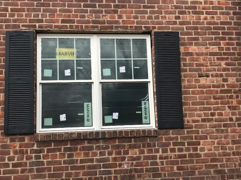 Marvin Essential double hung windows installed in brick